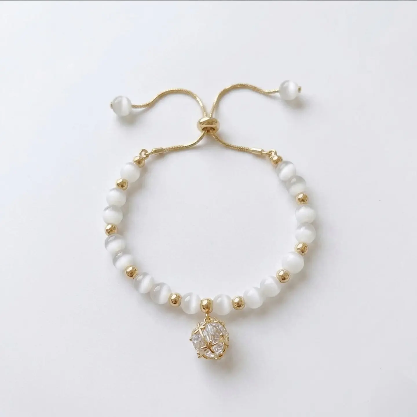 Pulsera ojo de gato colgante cristal 1