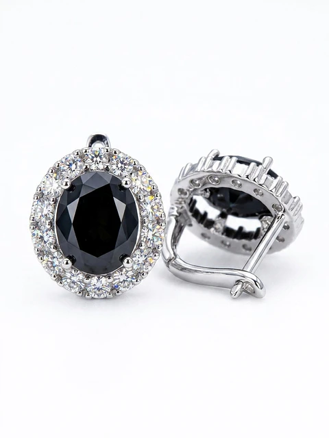 Aros piedra negra ovalada con halo de circonias