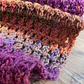 Pañuelo Brigitte crochet tonos morados y naranjos - Miniatura 3