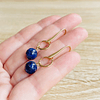 Aros dorados colgantes con Lapislazuli