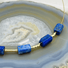 Collar dorado con tubos de Lapislázuli