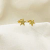 Aros estrella dorados