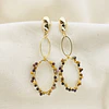 Aros dorados con piedras entorchadas
