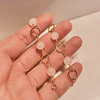 Pulsera argollas doradas con Cuarzo Rosado