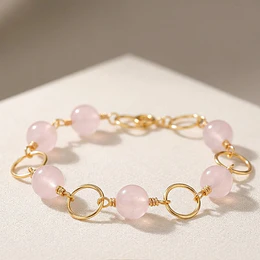 Pulsera argollas doradas con Cuarzo Rosado