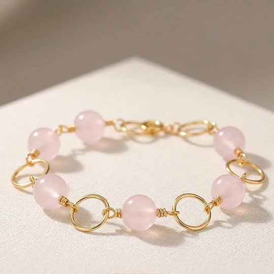 Pulsera argollas doradas con Cuarzo Rosado