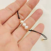Pulsera negra con perlas