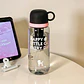 BOTE TRANSPARENTE PARA AGUA DE 800 ML (HAPPY LITTLE CAT EVERY DAY) MOD# ST-7139 - Miniatura 5