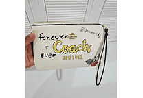 MUÑEQUERA IMITACIÓN COACH VARIOS DISEÑOS MODELO #200B5