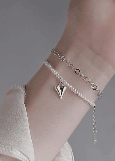 Pulsera de perlas con corazón doble capa