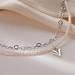 Pulsera de perlas con corazón doble capa