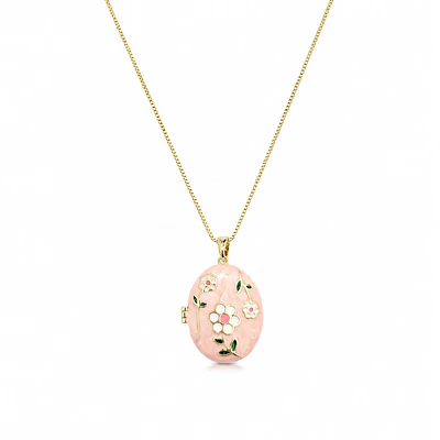 Relicario ovalado rosa con diseño de flores blancas
