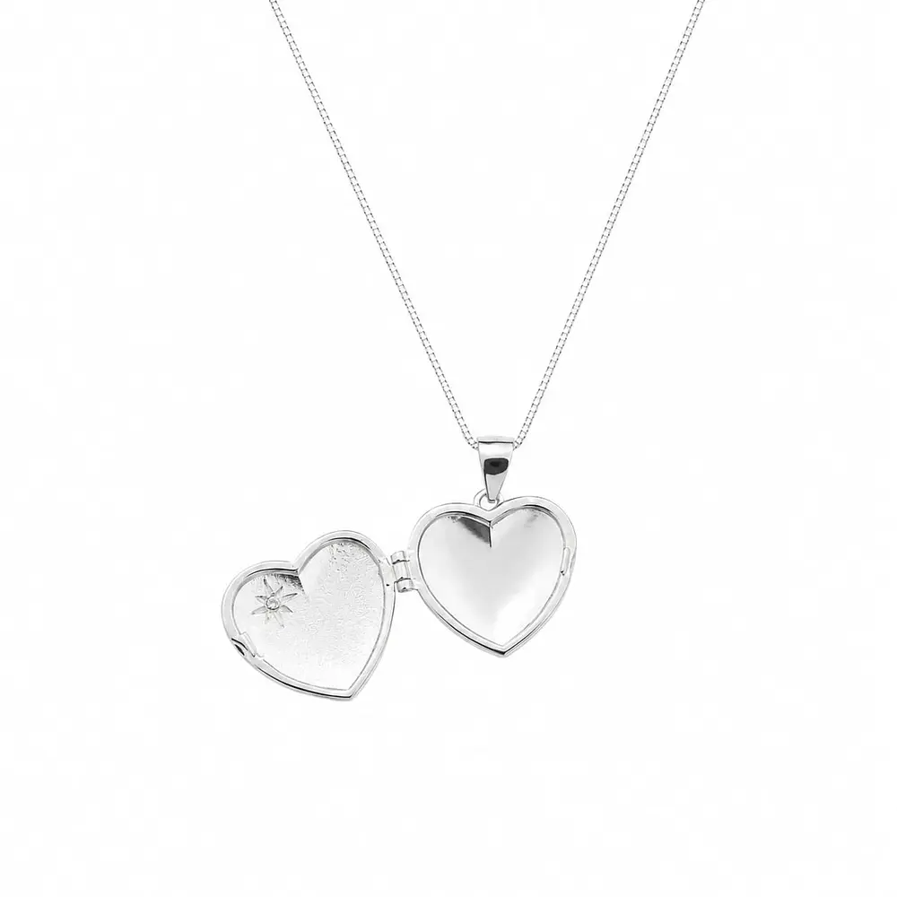 Relicario corazón con diseño de estrella Plata S925