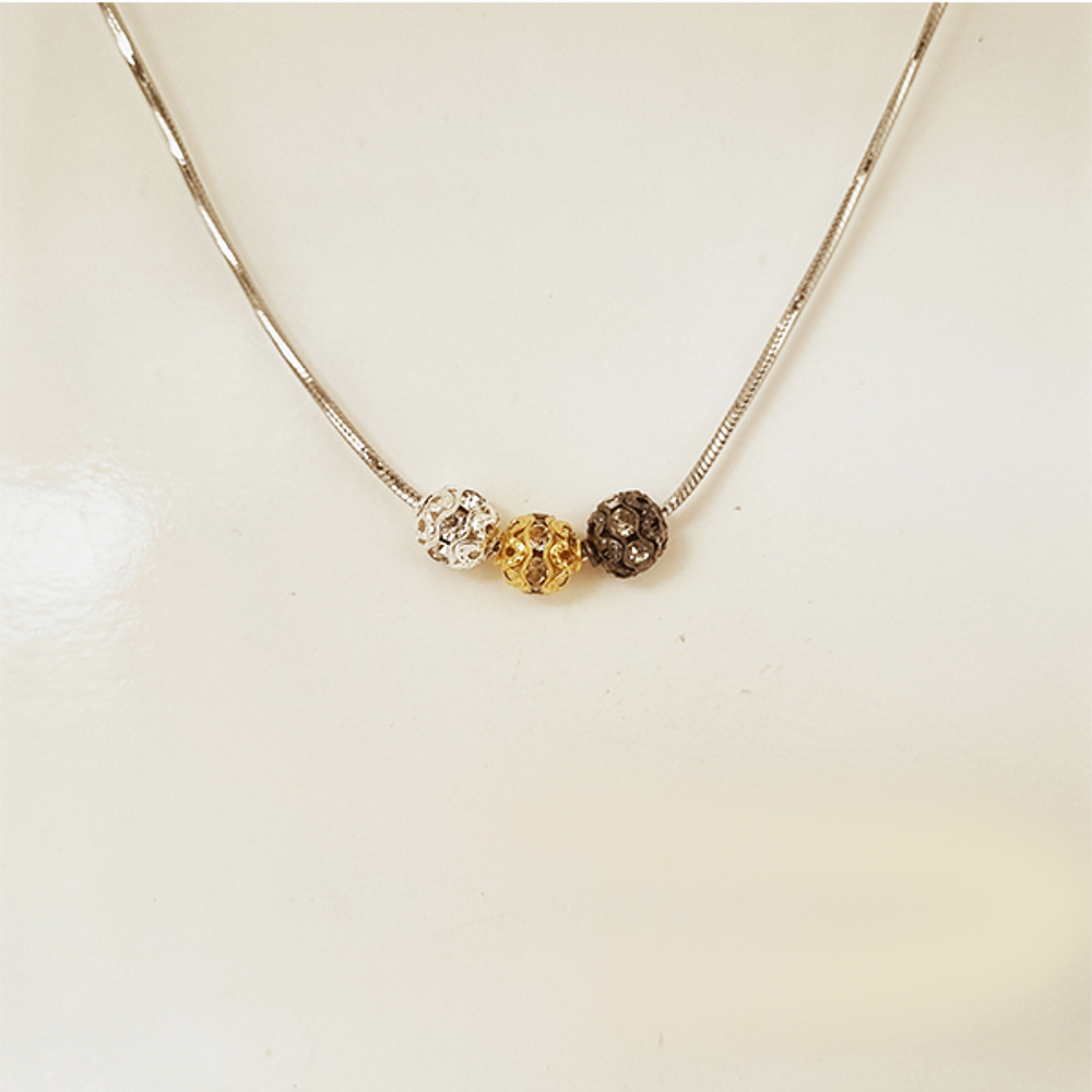 dije mini esfera dorada brillante