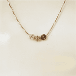 dije mini esfera dorada brillante