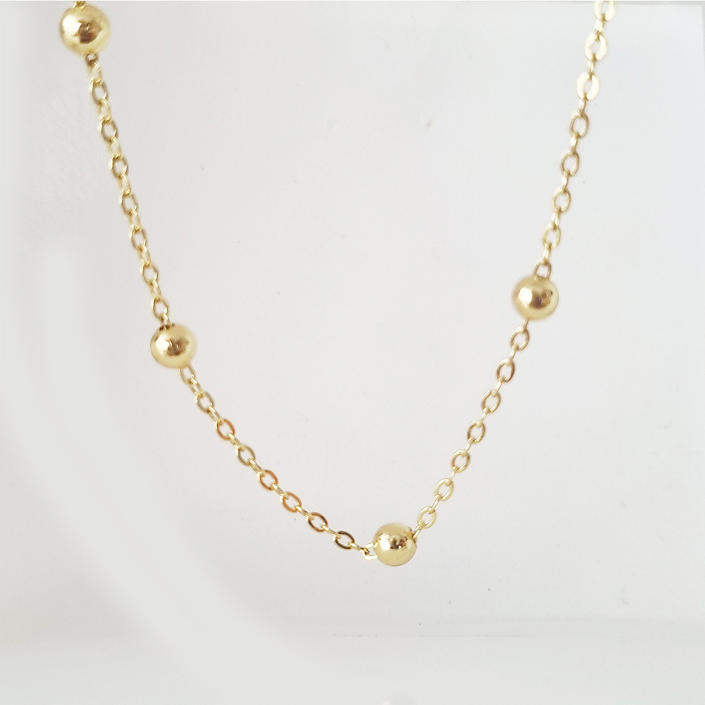 collar bolitas doradas