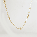 collar bolitas doradas