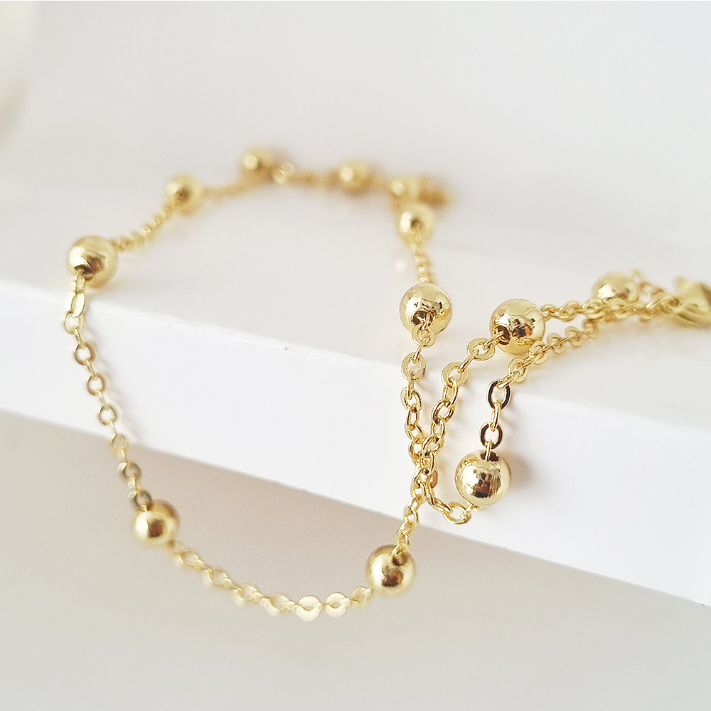 collar bolitas doradas