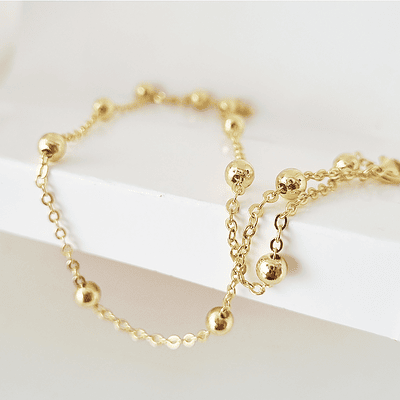 collar bolitas doradas