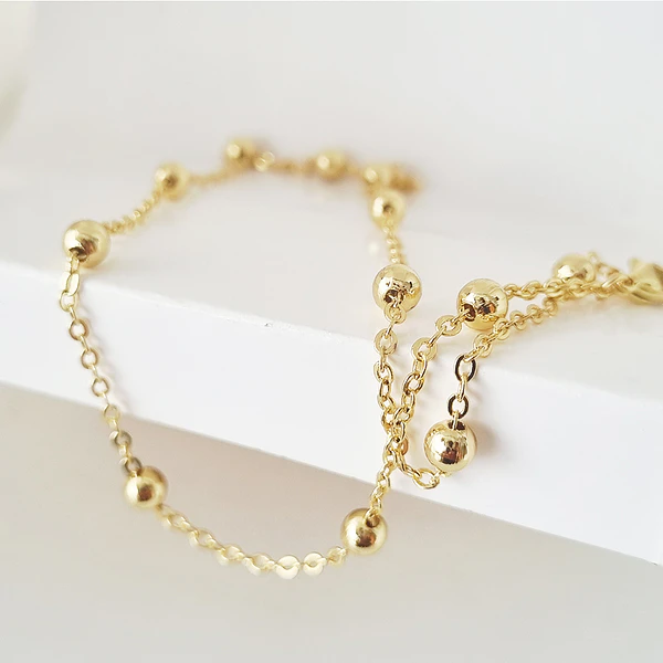 collar bolitas doradas