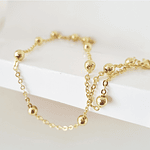 collar bolitas doradas