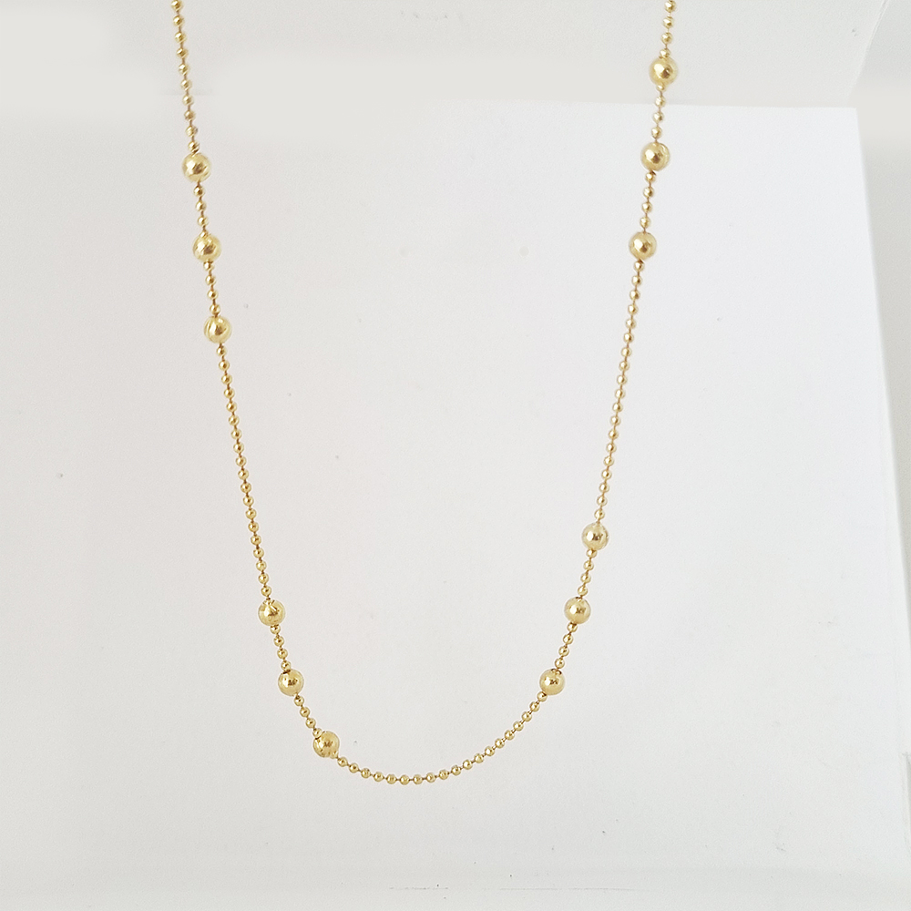 collar bolitas doradas