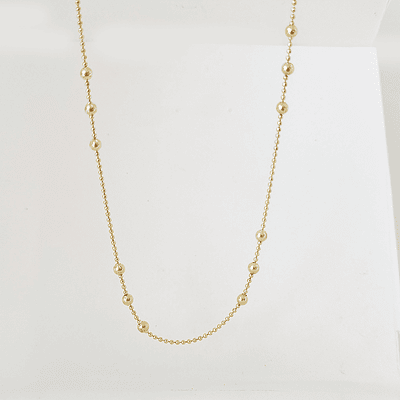 collar bolitas doradas