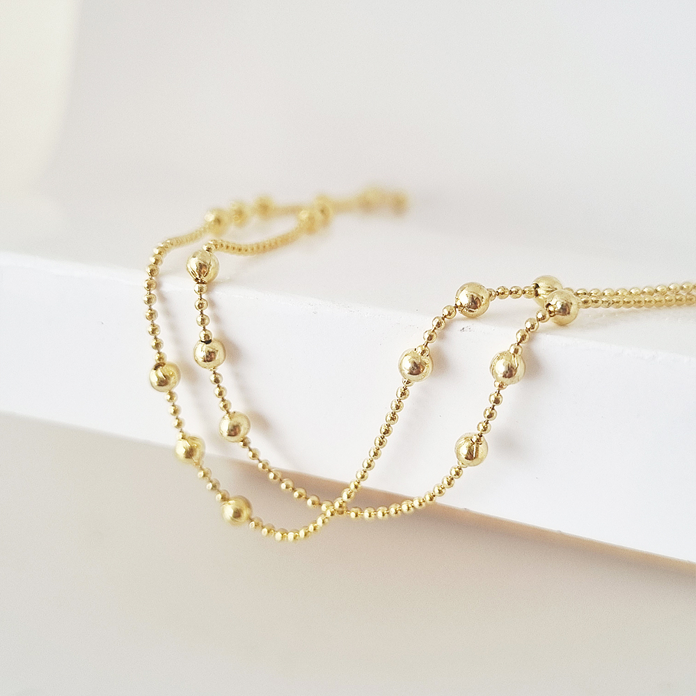 collar bolitas doradas