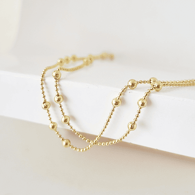 collar bolitas doradas