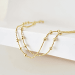 collar bolitas doradas