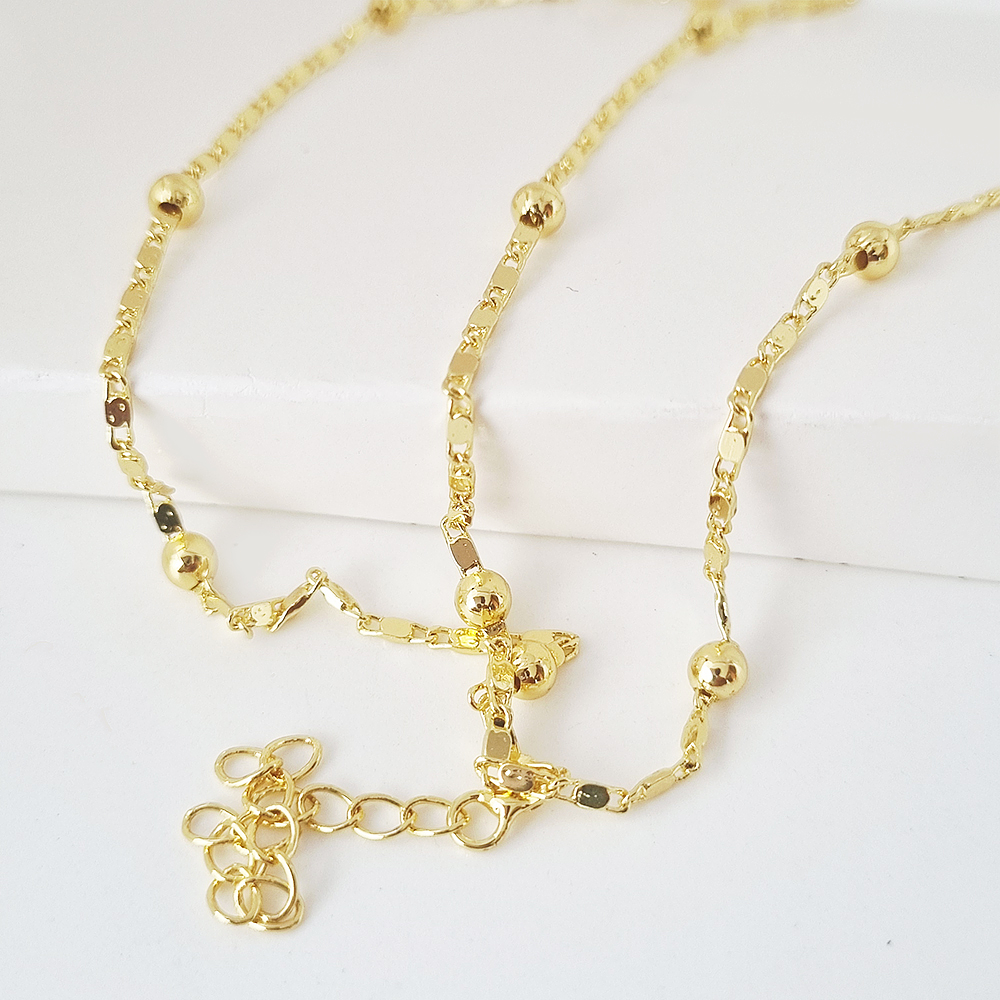 collar bolitas doradas