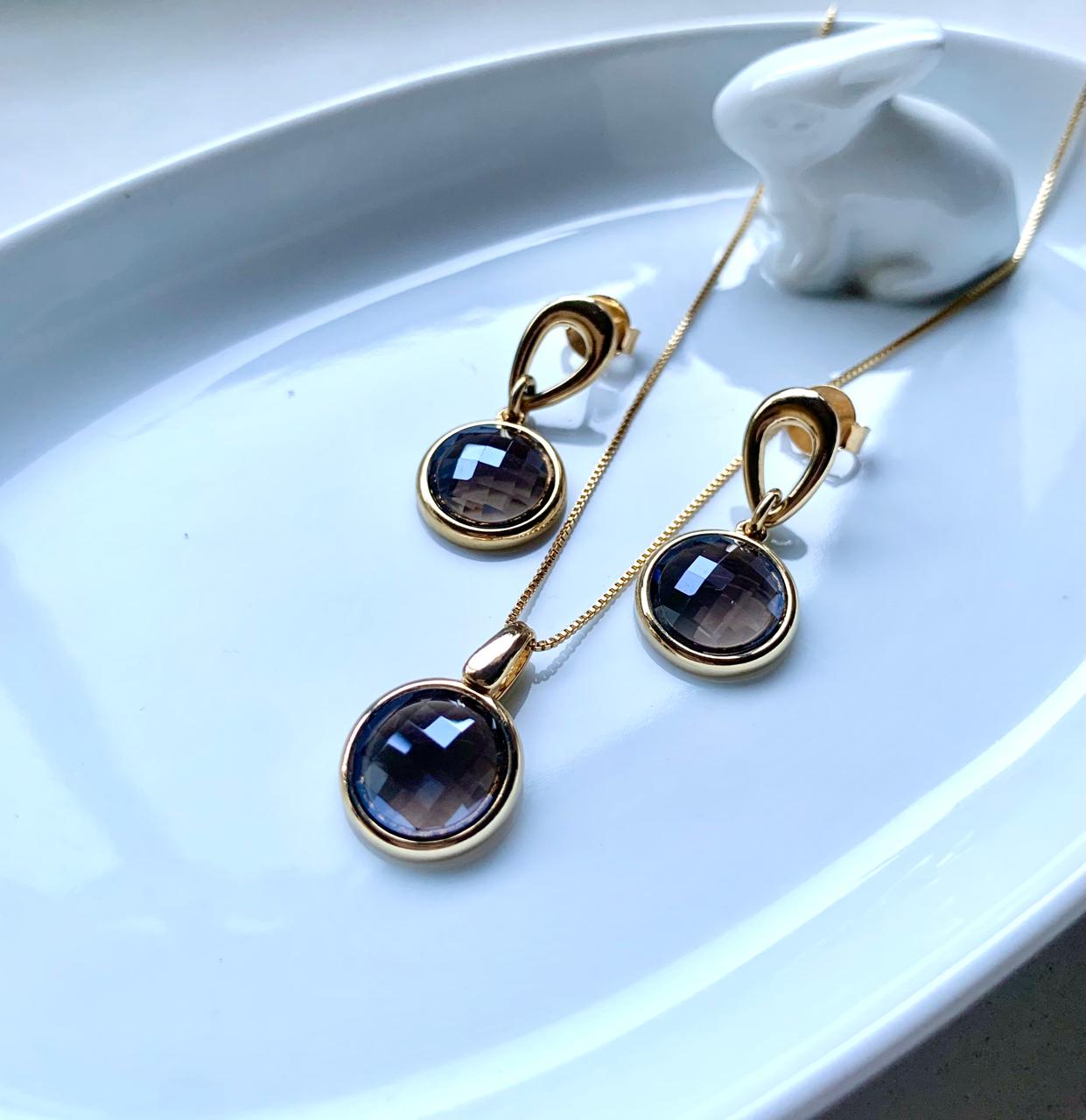 Conjunto baño de oro 18k con piedra cuarzo ahumado facetada .