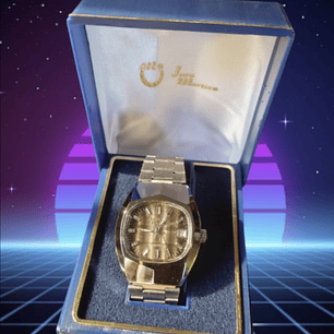 Jean Marttan acero esfera color Mostaza Nuevo sin uso ochentero con su caja original.