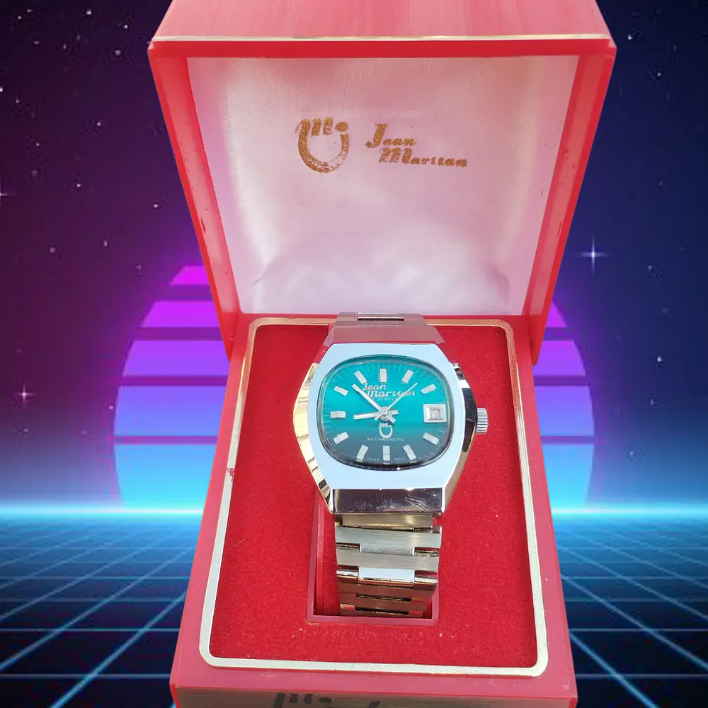Reloj Jean Marttan acero esfera turquesa nuevo sin uso. 1
