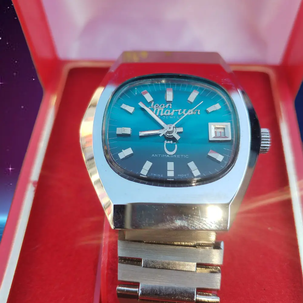 Reloj Jean Marttan acero esfera turquesa nuevo sin uso. 2