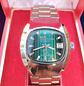 Reloj Jean Marttan acero esfera color Mostaza Nuevo sin uso ochentero con su caja original. - Miniatura 2