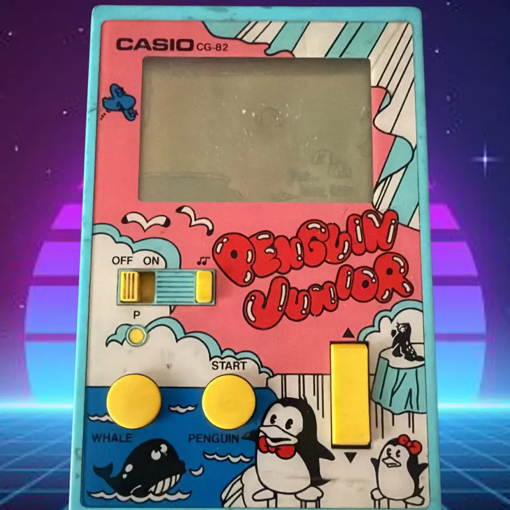 Casio CG - 82 Penguin Junior handheld Casio sin tapa de pilas FUNCIONANDO  2