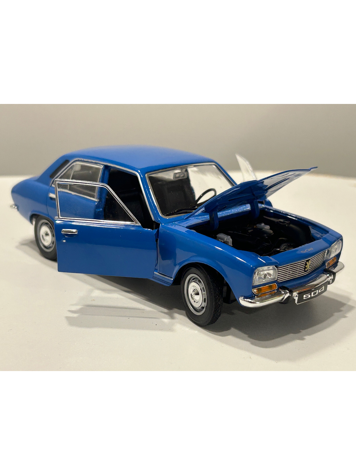 Peugeot 504 1975 azul Welly 1:24 – Clásico familiar y taxi de los 70 1