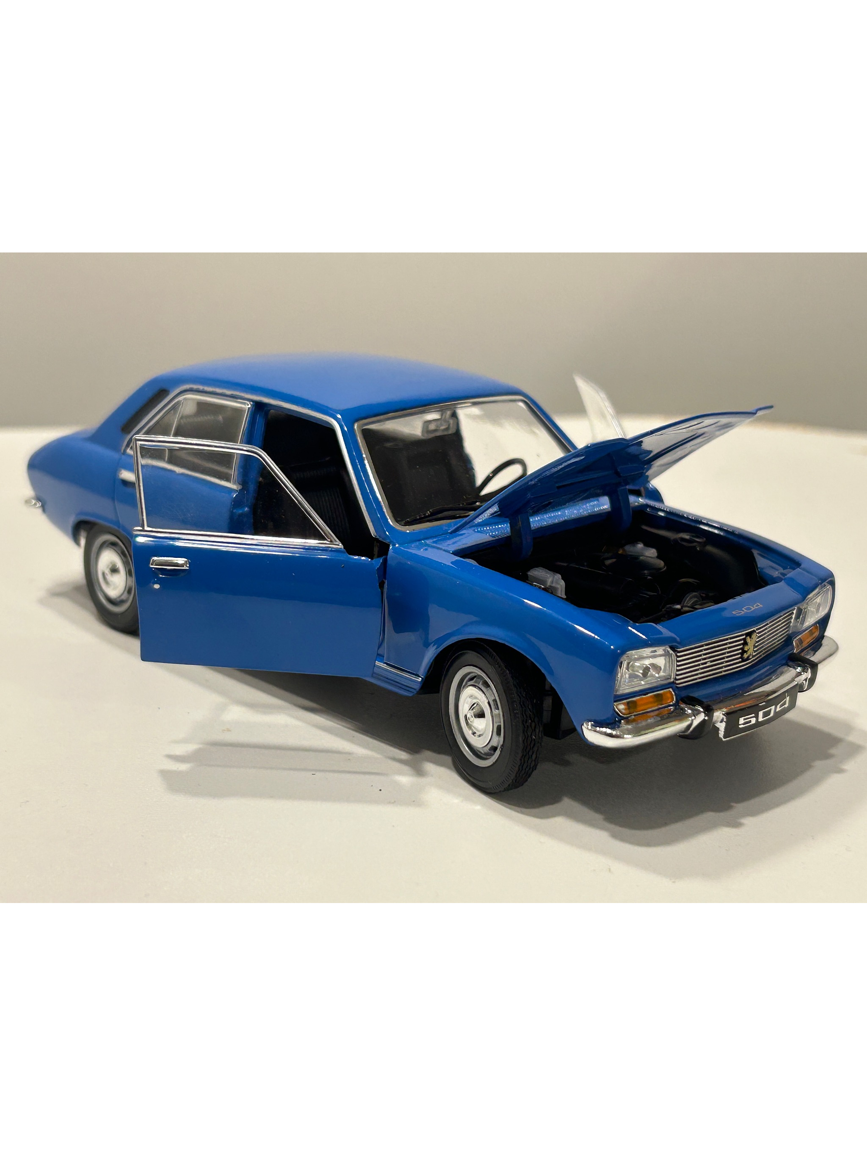 Peugeot 504 1975 azul Welly 1:24 – Clásico familiar y taxi de los 70 1