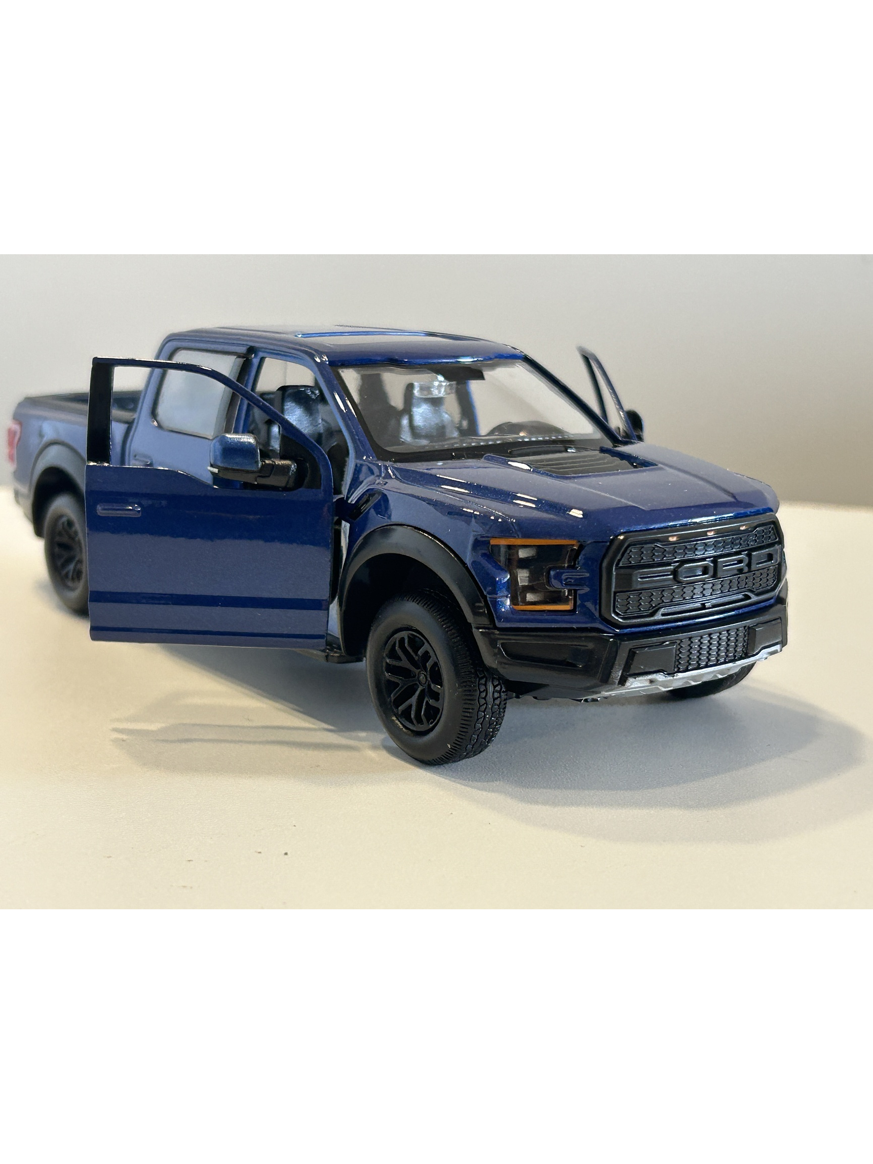 Motormax Ford F-150 Raptor 2017 azul metálico 1:24 – Pickup off-road ícono de Ford Performance 3