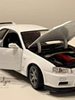 Nissan Skyline GT-R (R34) — Welly NEX Models 1:24 | JDM Legend de colección - Miniatura 1
