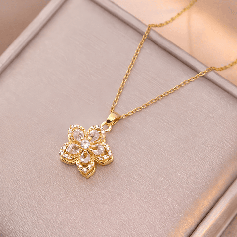 Collar Flor Dorada Giratoria con Brillantes en Acero Inoxidable