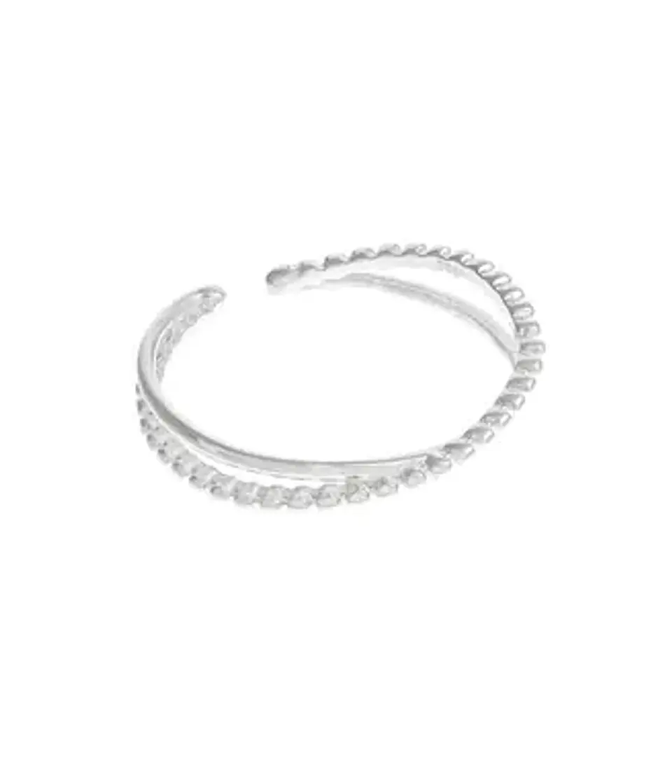 Anillo cruzado de plata con bolitas. 1