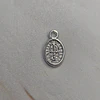 MINI MEDALLA OVALADA SAN BENITO 12MM ENCH.PLATA