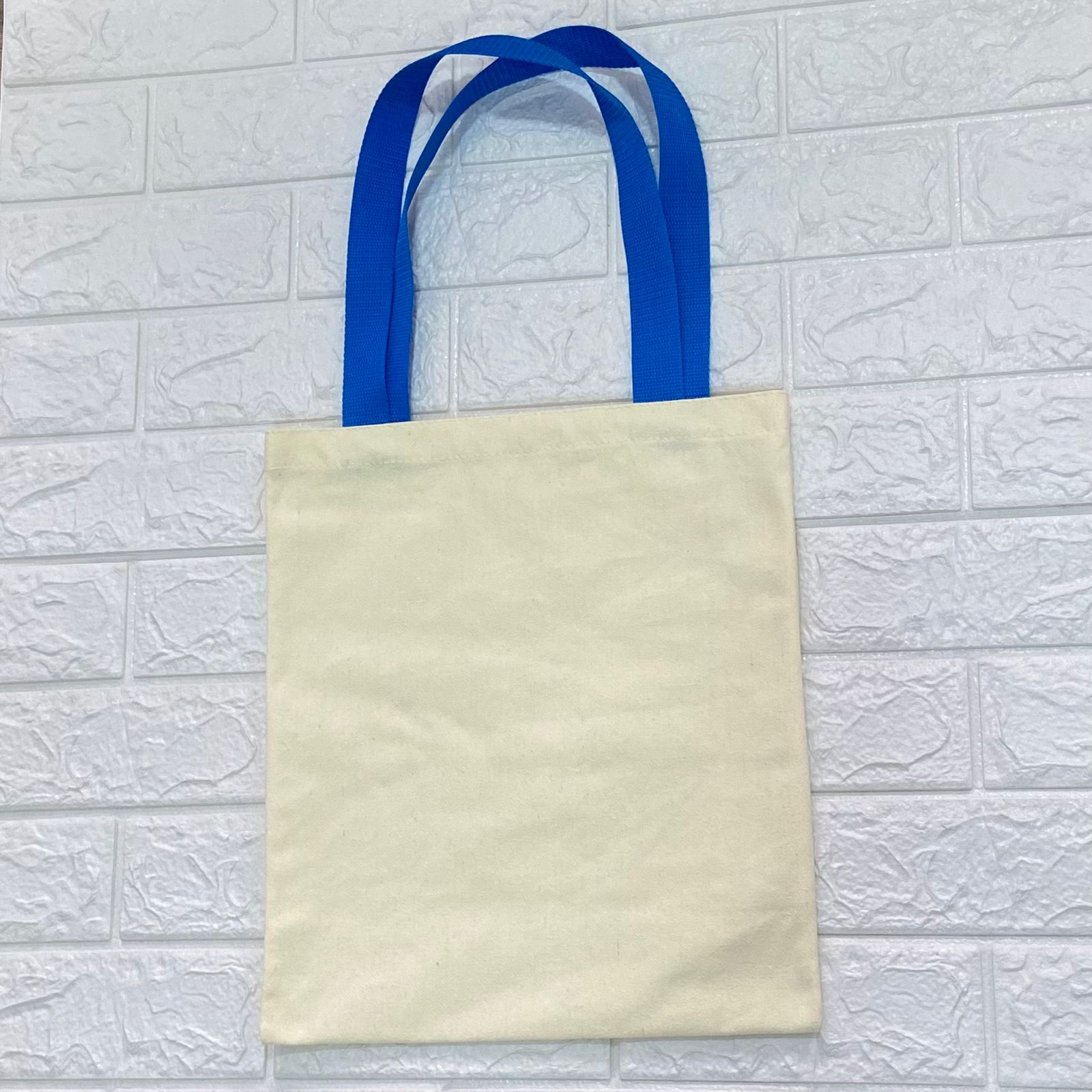 Pre venta. Bolsa Crudo Poliester Color Mantequilla 35x30 cm. Asa Huincha Azul