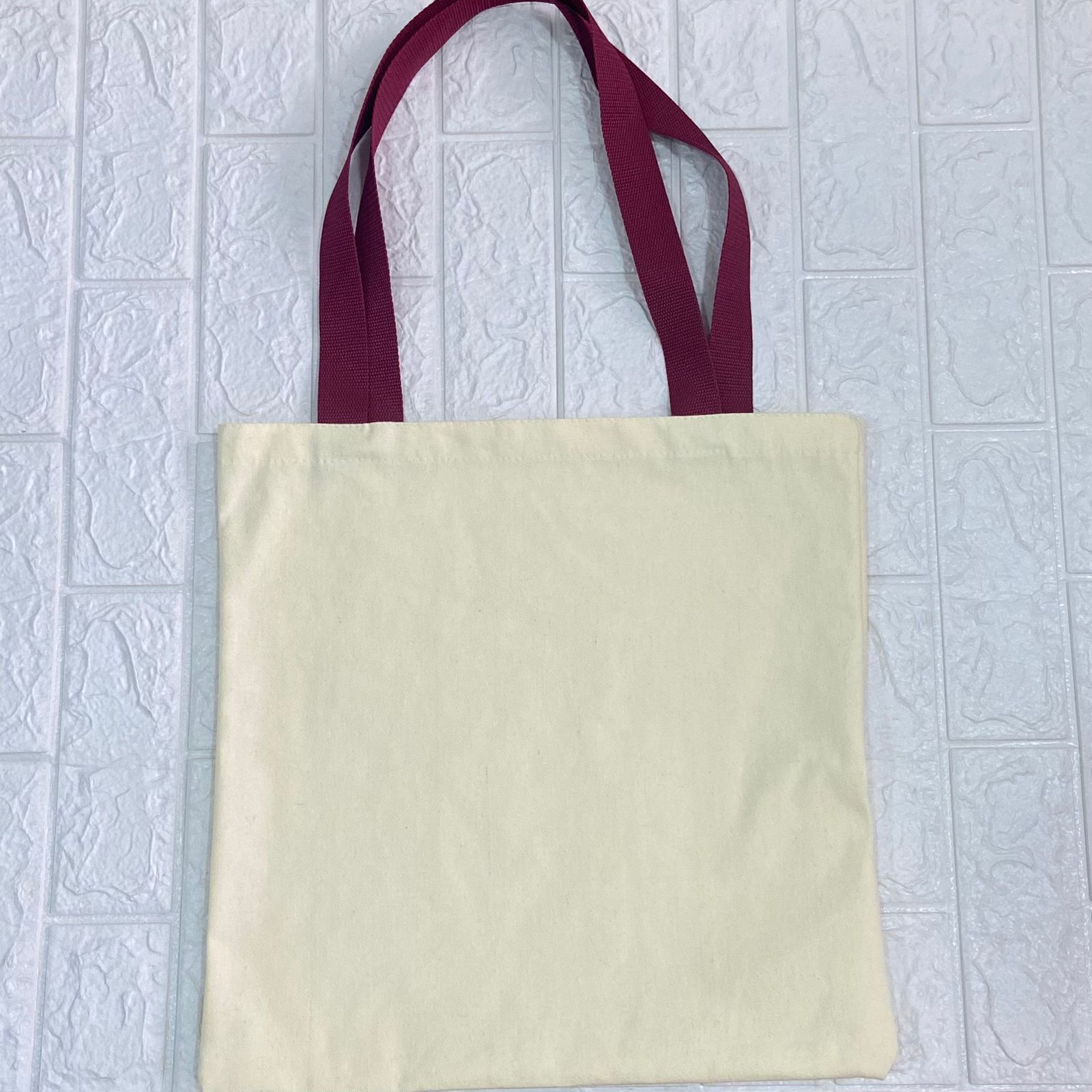 Pre venta. Bolso Totebag Crudo Poliester Color Mantequilla 40x40 cm. Asa Huincha Rojo Vino