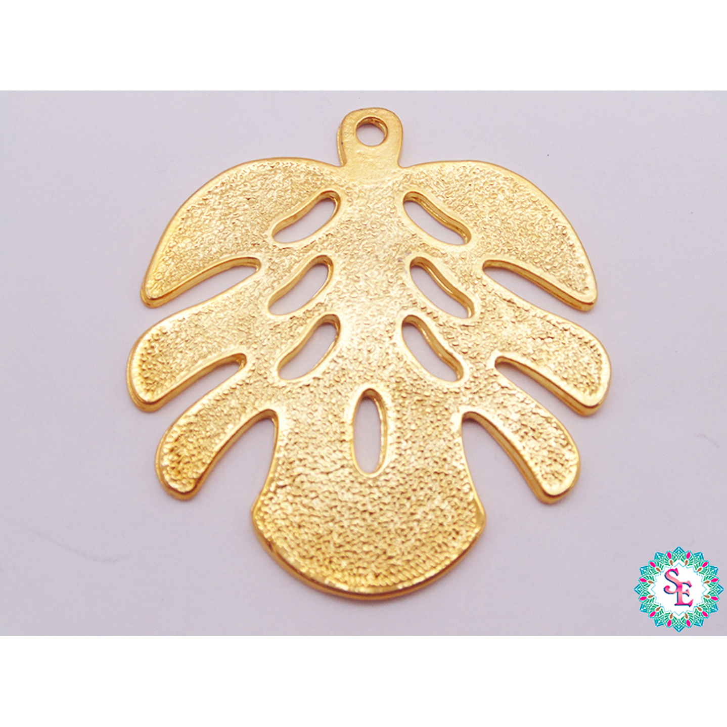 SAMAK DORADA DIJE HOJA PUNTEADA MEDIANA 68*58MM X UND  1