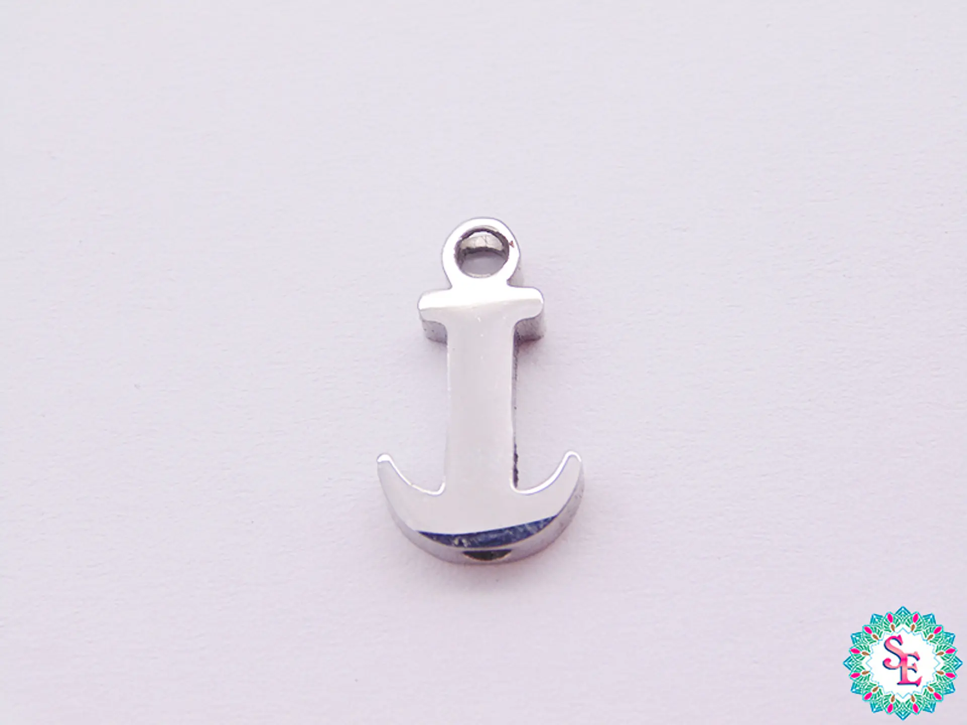 ACERO PLATEADO SEPARADOR ANCLA 18*8*3MM   1