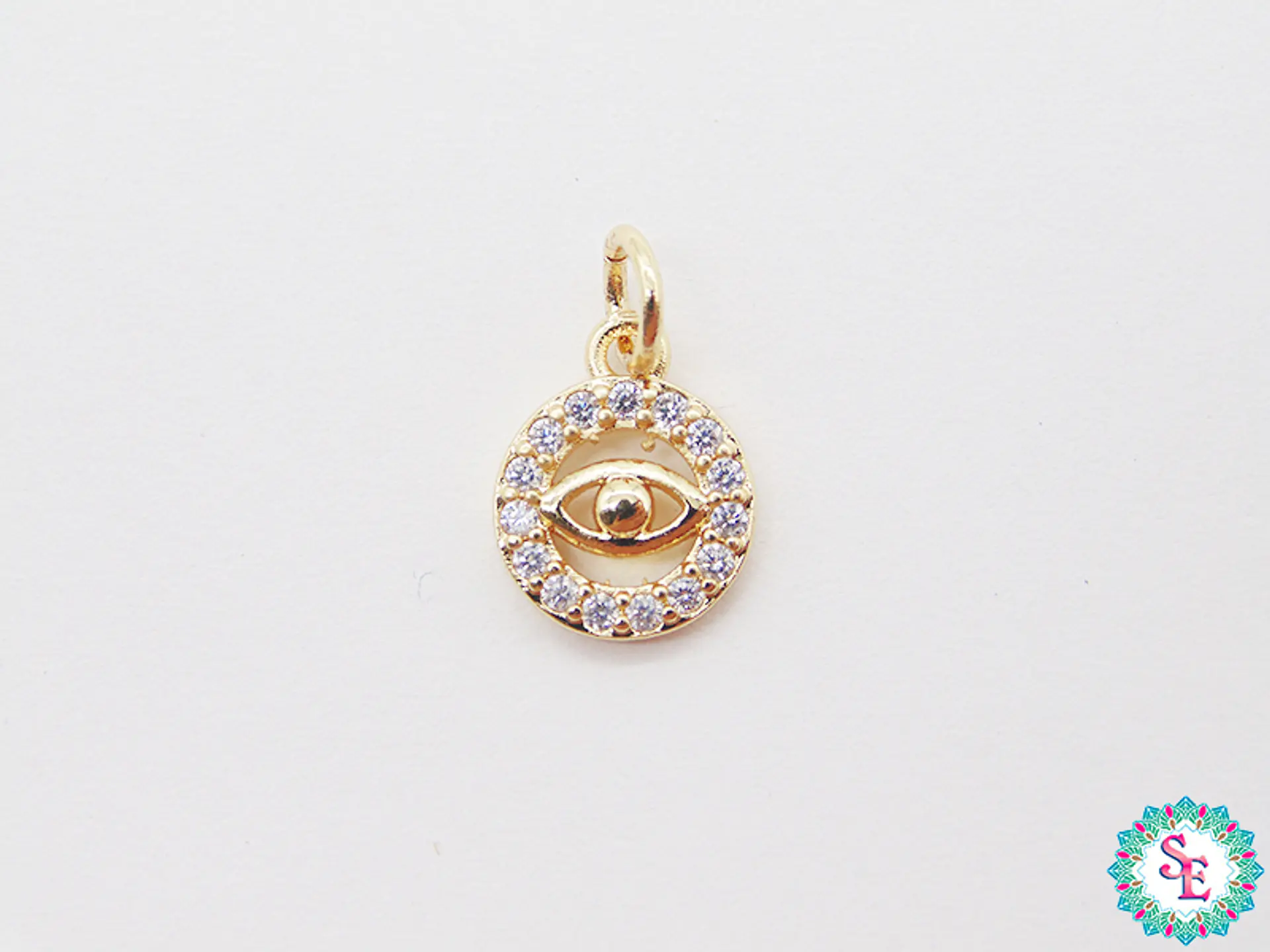 RODIO DORADO DIJE CIRCULO OJO CIRCON BLANCO 9MM  1