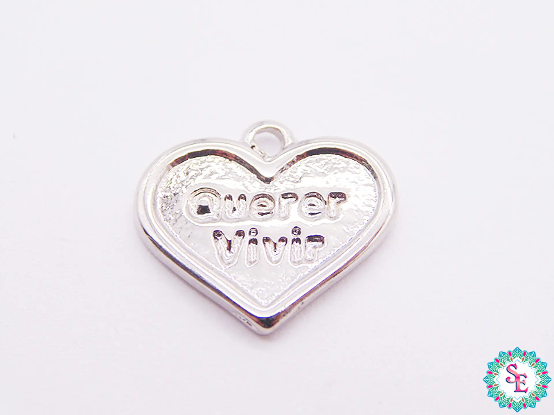 SAMAK NIQUEL DIJE CORAZON QUERER VIVIR 19MM X UND  1